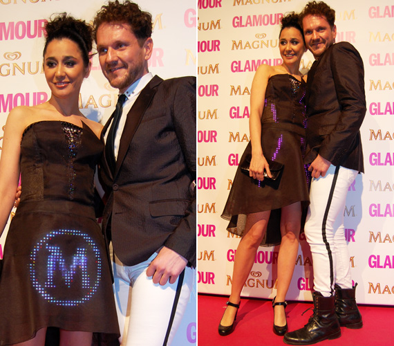 	Gryllus Dorka és Lakatos Márk már régóta jóban vannak: ennek ellenére a színésznő ruháján villódzó M betű nem a stylist keresztnevére utal, hanem a Glamour-gála fő támogatójára.