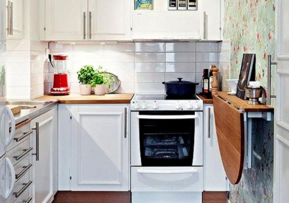 Gondoltál már lehajtható konyhaasztalra? A fenti képen látható megoldás nemcsak helytakarékos, de jól is mutat. A székeket lehet más helyiségben tárolni, és csak ebédnél kivinni a konyhába.